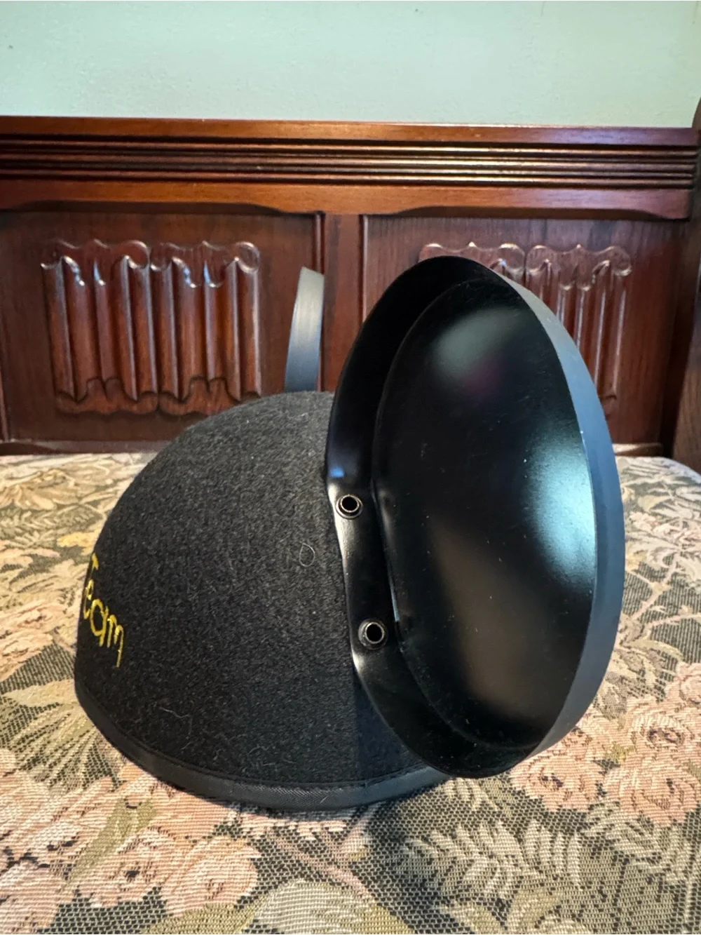 Disney black Mickey Mouse ears hat with red patch.